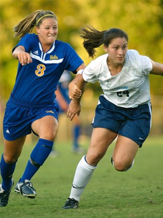 Photo of North Carolina's Jessica Maxwell v. UCLA's Kim Devine in 2003 by Shane Lardinoi @ nc-soccer.com
