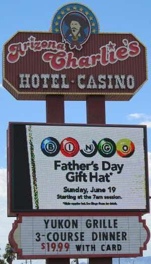 Pic of the sign along Boulder Highway for Arizona Charlie's Hotel Casino in Las Vegas, NV, home of the Palace Grand Lounge, the Market Buffet, and the Yukon Grille.