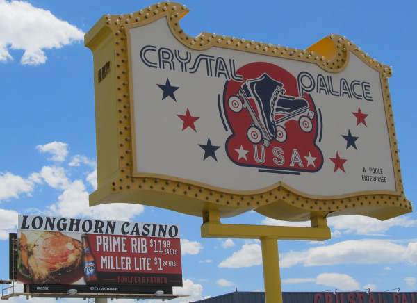 Pic of the Crystal Palace USA Roller Skating Rink sign in from of a billboard for the specials at the Longhorn Casino on Boulder Hwy in Las Vegas, NV.