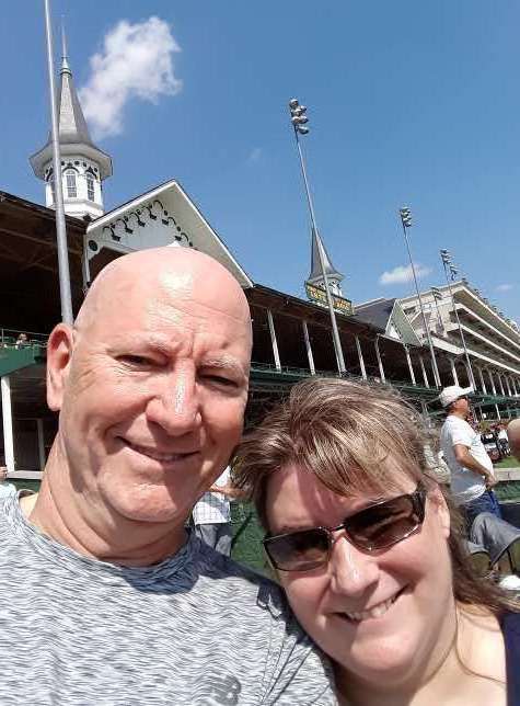 Mike Kimbro and Paula Hahnert posing in front of the Twin Spires at Chruchill Downs in the South End of Louisville, Kentucky.