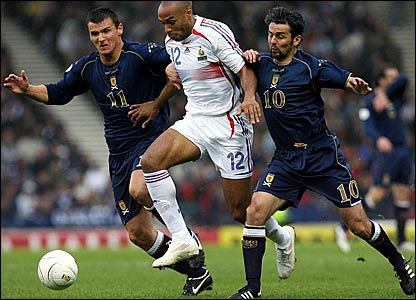 Photo Credit:  BBC Soccer Site, photo of Henry being double teamed by Scotland defenders, "Scotland continue to hurry the French after the break and come close to breaking the deadlock but McFadden fires wide"