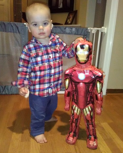 Here's young Luke Neilon posing with an Iron Man pinata during his birthday.