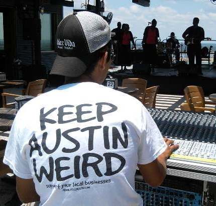 Photo of young man wearing a "Keep Austin Weird" T-shirt while operating a sound console for the gospel group Wesley Bray and the Disciples of Joy, while they were performing at a gospel brunch at an eatery overlooking Lake Travis near Austin, TX.