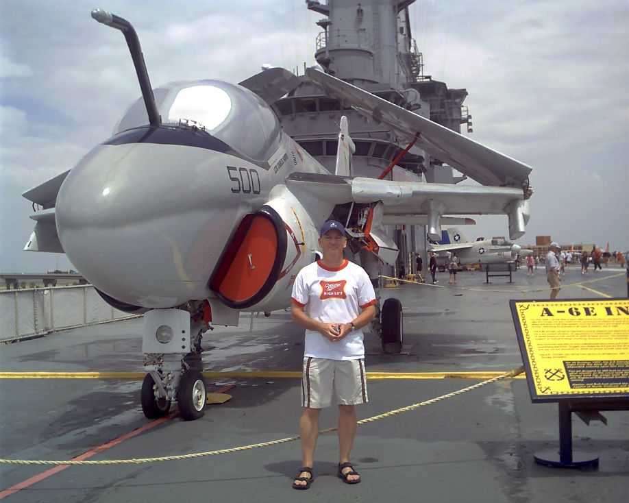 Texan windsurfer Mike Kimbro in front of an A6 on the flight deck of the air craft carrier USS Lexington in Corpus Christi Bay in August 2007.