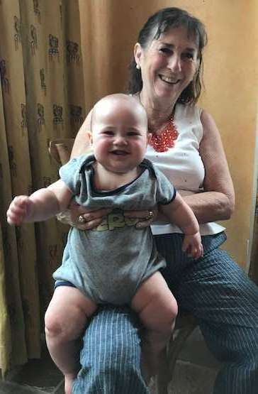 Here's Ben Neilon being held by paternal grandmother Antoinette Neilon, aka Toni Neilon of Duncanville, TX, a former Texas high school French teacher, and all-around awesome person.