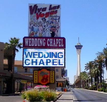 Pic of the world famous Viva Las Vegas Wedding Chapel at the Super 8 Hotel North Strip on Las Vegas Blvd, with The Stratosphere Las Vegas in the background.
