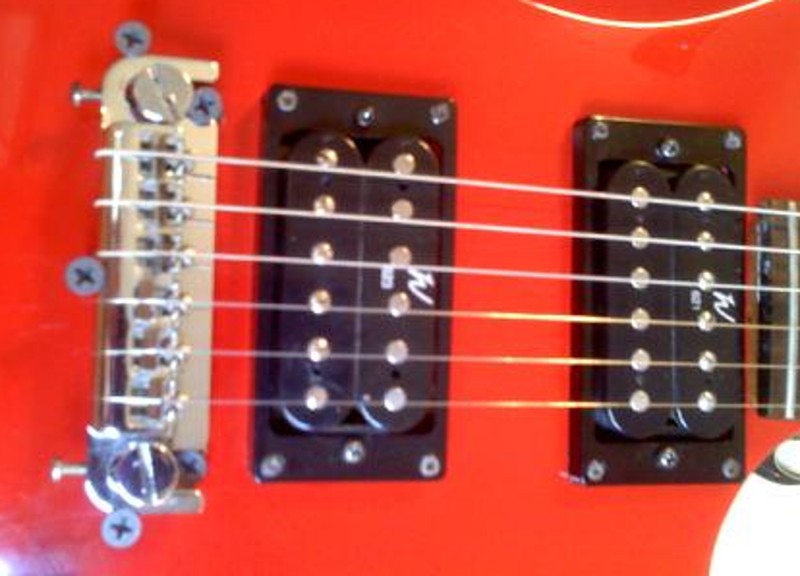 Repairing the wraparound bridge on a BC Rich Warlock model electric guitar, specifially the Bronze series Warlock.  Not the pickup upgrade to the Washburn 620 series (621 and 623) pickups.