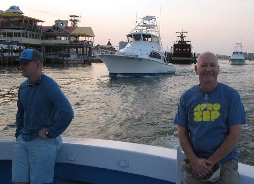 Rocking an awesome t-shirt celebrating the AfroZep band, that's poet Chrome Dome Mike with Thomas Maxwell of the US Army onboard the mighty charter fishing boat Big John which docks near the Emerald Bay at Harborwalk Village in Destin, Florida.