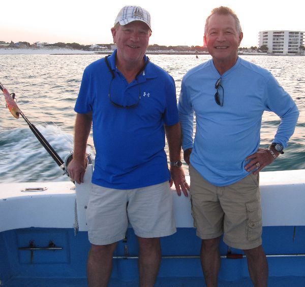 Gary Maxwell and Gene Ursten of Destin Florida on board a charter fishing boat which docks near the Emerald Grand at Harborwalk Village.