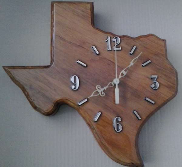 Pic of handmade wall clock in the shape of Texas #1396 by Bob Harbison of Kraf Naf of Hurst, made of pecan from the clear fork of the Brazos River in Stephans County Texas.
