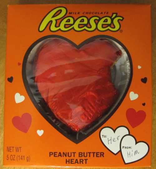 A heart with a bite missing made of Reese's peanut butter with milk chocolate.