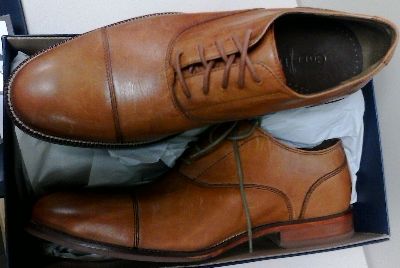 In a British Tan finish, here's a pair of Cole Haan Williams Cap Toe shoes for men.