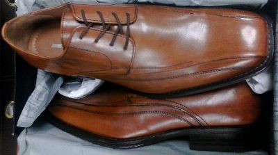 In tan, a pair of Johnson and Murphy Harding Panel men's shoes.