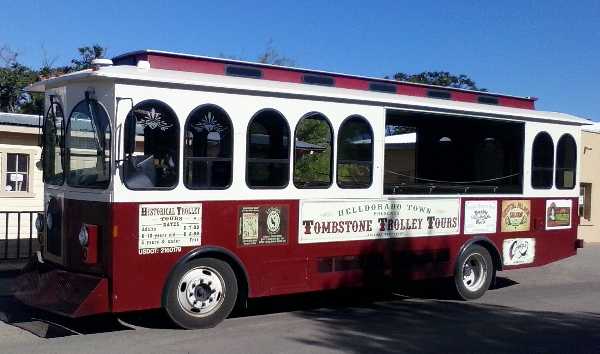 Photo of the Tombstone Trolley Tours bus-like vehicle employed by  the Helldorado Town Wild West theme park which features panning for gold.