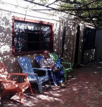 Photo taken of Chrome Dome Mike relaxing at The Rose Tree Exhibit and 1880 Museum on 4th Street in Tombstone, AZ, taken in April 2015.
