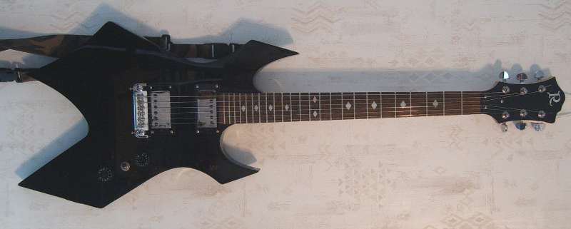 This interesting axe is probably a B.C. Rich Warlock Counterfit Series, there's no neck plate and only an R on the headstock.  Still, it's short scale neck feels great and is very playable.