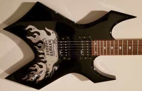 Body shot of a black B.C. Rich Warlock Special Edition electric guitar with BDSM pickups and standard bridge built into the chrome Afteburn Flame treatment.
