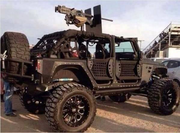 A photo of a Jeep fitted with a machine gun for American militia duty.