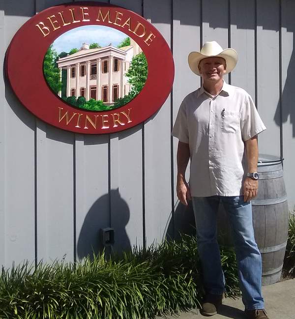 Standing before the Belle Meade Winery at the Belle Meade Plantation.