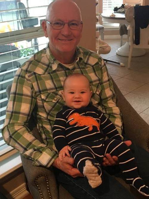 In this photo Chrome Dome Mike holds his second grandchild Ben Neilon in 2018.