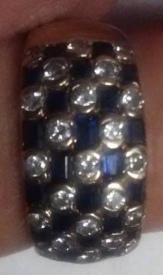 Pic of my lucky checkered flag ring of diamonds and sapphires in 14k gold which was bought from a pawn shop in Dallas, TX.