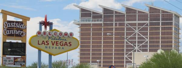Pic of the Welcome to Las Vegas sign on Boulder Hwy with the Eastide Cannery Casino Resort in the background.
