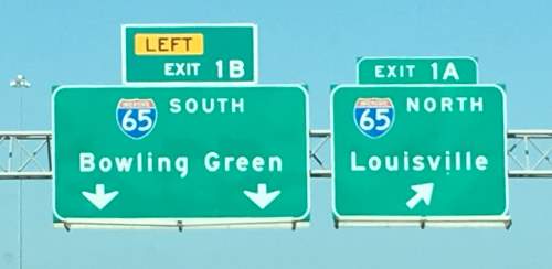 Sign seen when approaching Interstate 65 in Kentucky, indicating directions to Louisville, North, and Bowling Green in the Southern direction.