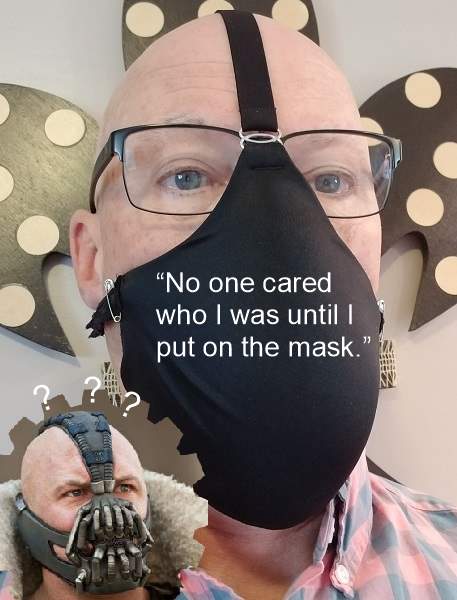 Here's the author sporting a stylish Tri-Strap Face Mask, as he is questioningly regarded by the Batman comic villain Bane, from DC Comics.