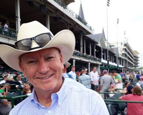 Chrome Dome Mike rocking a Resistal Cowboy Hat at Churchill Downs on Thurby 2019.