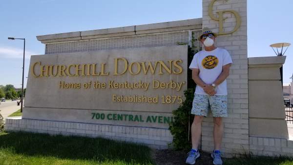 Chrome Dome Mike standing by the Central Avenue entrance to Churchill Downs on the first Saturday in May of 2020, the year of the COVID pandemic.