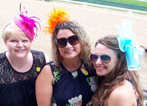 Three beauties wearing facinators at Churchill Downs in Louisville, Kentucky in June 2019.