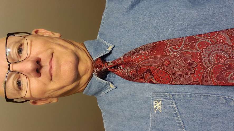 A cool all silk tie made in China for Mazzoni, working well with a denim shirt by Cutter and Buck..