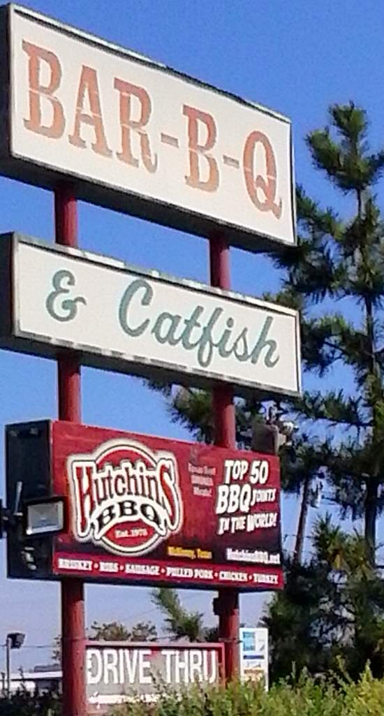 Sign for Hutchins BBQ and Catfish resturaunt, as seen from Tennessee Street in McKinney, TX.