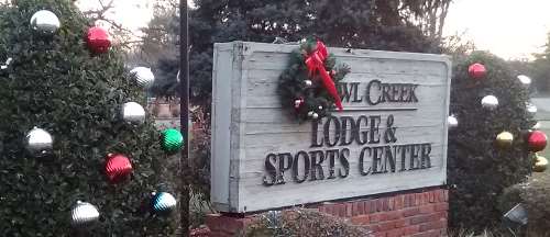Holiday season adorned sign which sits in front of the club house of the Owl Creek neighborhood of Louisville, KY.