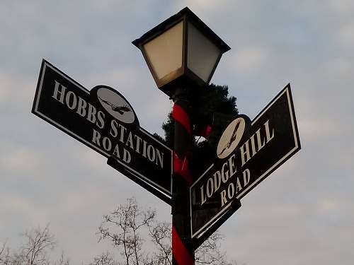 A street sign in Owl Creek for Hobbs Station Road, found in front of the Owl Creek subdivision's lodge.
