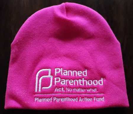 A pink knit cap with the logo of the Planned Parenthood Action Fund.
