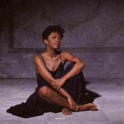 Back cover art for the Rapute album by Anita Baker, which features both "Sweet Love" and "No One In The World". 