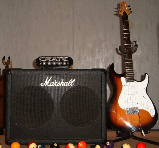 Samick Malibu MB1 electric guitar by Greg Bennett Design with a Crate Power Block amp head and a Marshall 212 Stereo Speaker Enclosure model 8222.