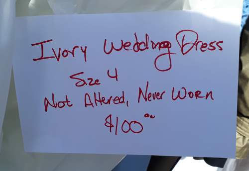 Sign on a wedding gown at a yard sale in Louisville, KY.