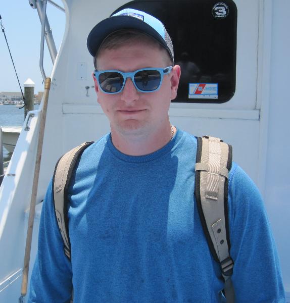 US Army officer Thomas Maxwell stepping off of the Big John charter boat in Destin, FL.