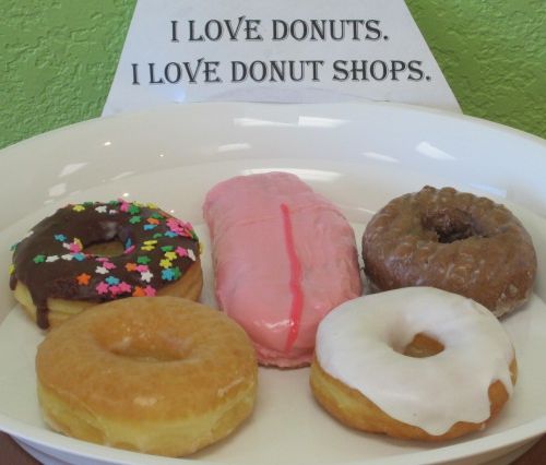 Image Credit:  Featuring the custom made, of a kind, TONGUE donut, this donut assortment was prepared by the good folks at Sweet Spot Donuts & Drinks in Grapevine, Texas.