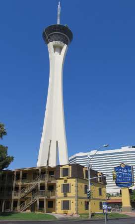 Featuring the Las Vegas Landmark The Stratosphere in the background, a pic of the Siegel Suites Paradise Apartments located just across the street from the Siegel Suites St. Louis Apartments, in the area of Las Vegas called The Naked City.