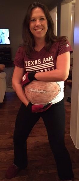 My daughter in her halloween costume, as a Texas A & M running back, with her pregnant XXL tummy being the football.