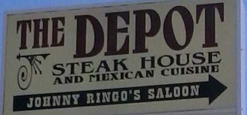 Sign for The Depot Steak House and Mexican Restaurant and infamous Johnny Ringo's Saloon.